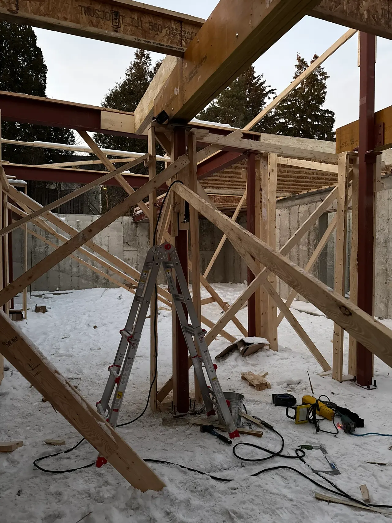 Steel post and beam connection inside a building under construction