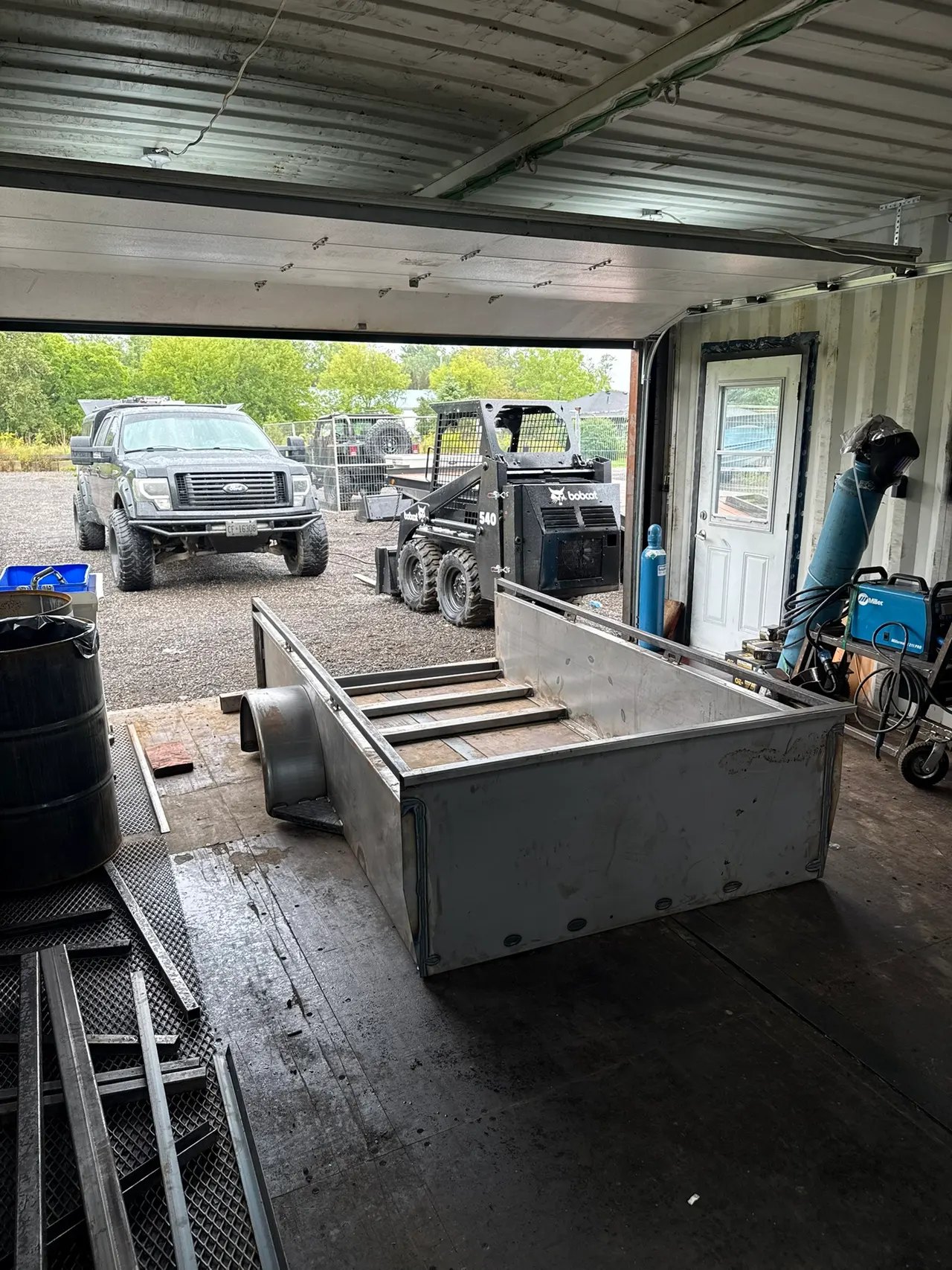 Fabricated metal trailer body standing in the workshop