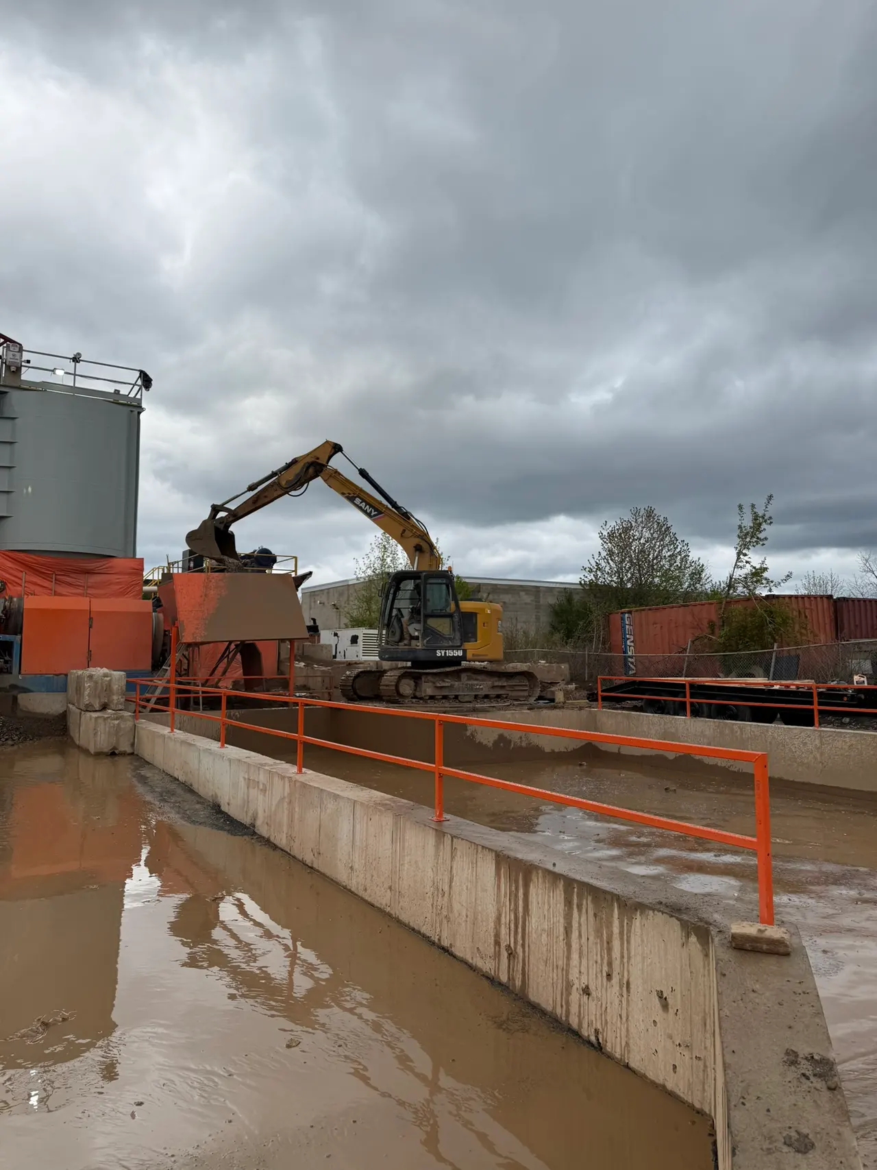 Bright orange railings surrounding the washout pit at a Hamilton plant